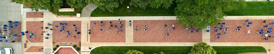 Students walking on mall during welcome week pathway tradition
